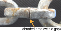 Closeup photo of a tread chain with poor welding