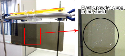 Photo of plastic powder clung to a day anti-glare shield