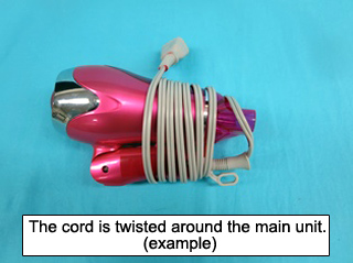 Photo of a hair dryer when its cord is twisted around the main unit